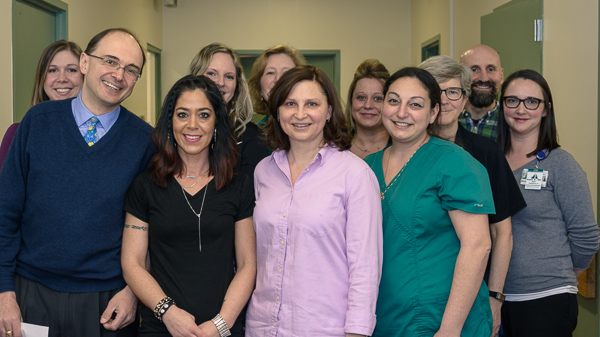 Several faculty and staff of the MSU Pediatrics and Human Development Division of General Pediatrics gathered in an MSU Clinical Center Hallway