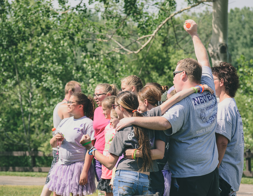 Group of walkers and runners celebrate before starting the 2017 Great Strides 5K