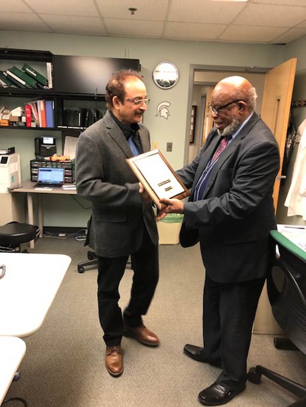 Ajovi Scott-Emuakpor, MD presents the William B. Weil, Jr. Endowed Distinguished Pediatric Faculty Award to Mahesh Sharman, MD